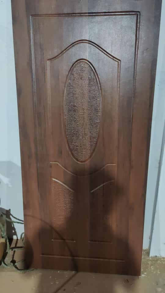 Embossed membrane door